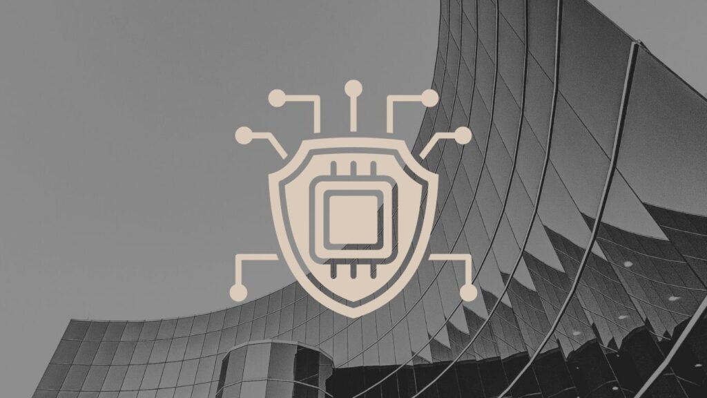Duomenų apsauga ir dirbtinio intelekto saugumas – skydas su mikroprocesoriaus simboliu virš modernaus stiklinio pastato.